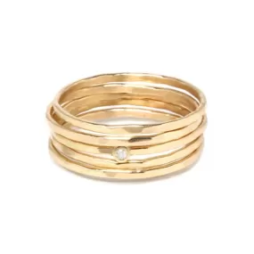 Five Gold Thin Hammered Stacking Rings with Single Diamond